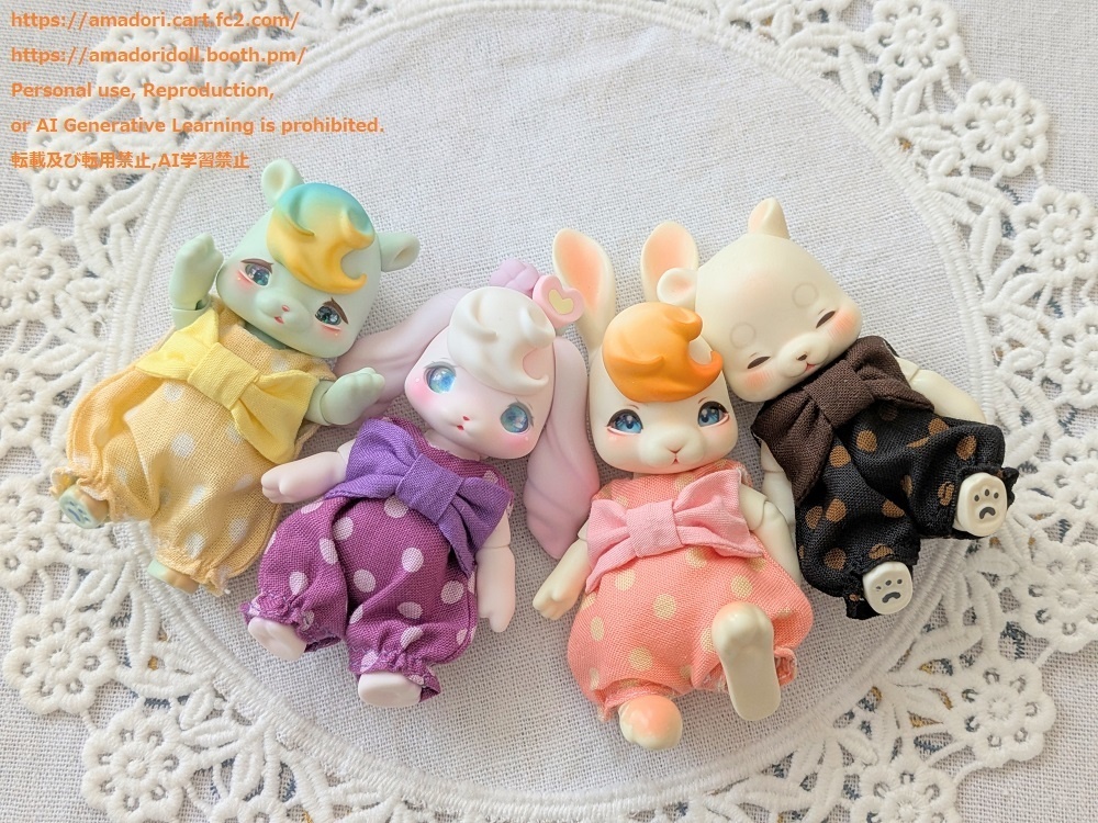 大きなリボンのロンパース