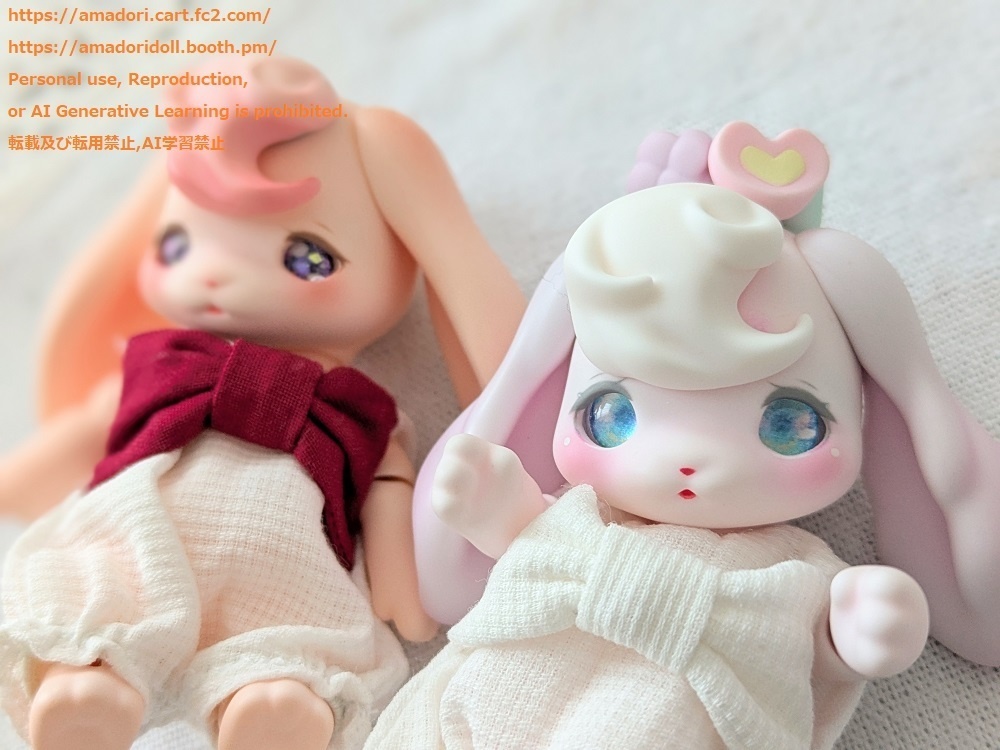 大きなリボンのロンパース