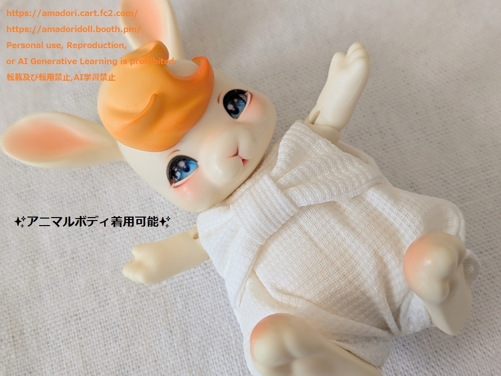 大きなリボンのロンパース