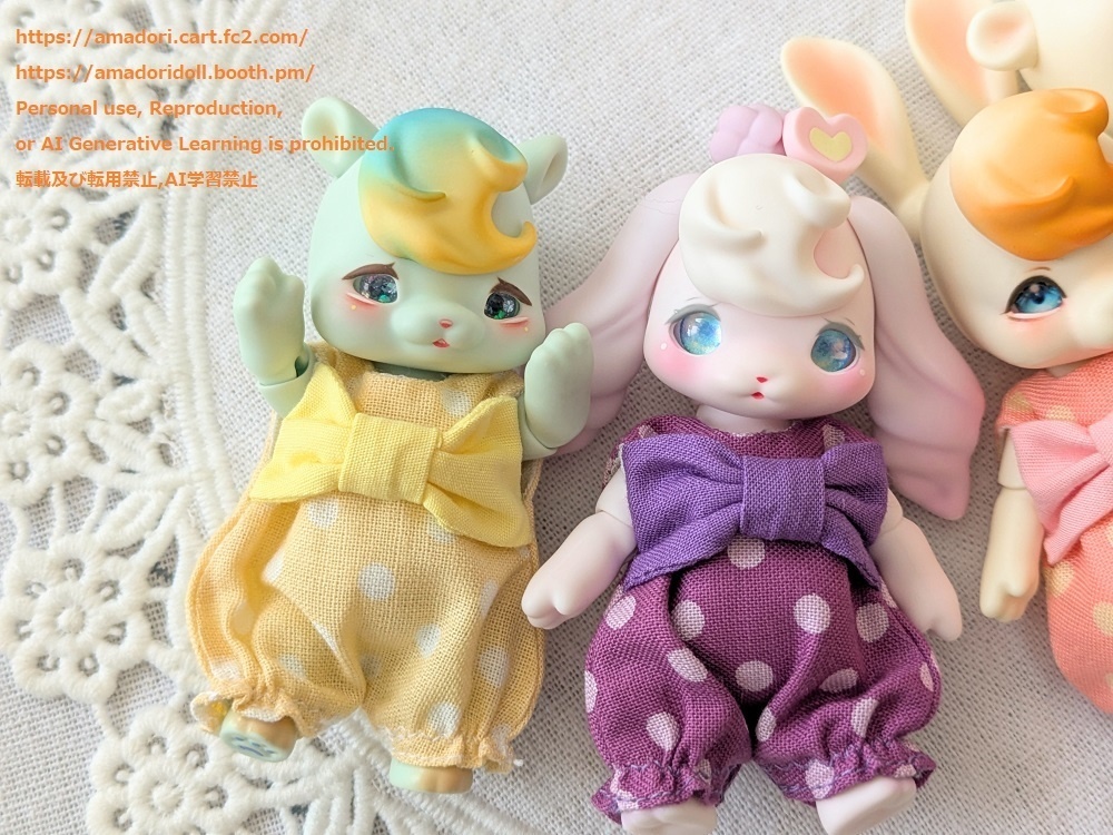 大きなリボンのロンパース