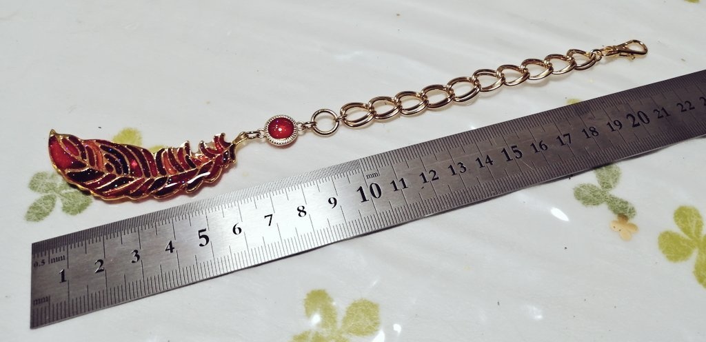 【ゴールド・シルバー】紫外線に反応して色が変わる羽根のバッグチャーム