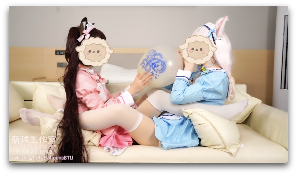 猫娘ペアがT 36風船を口で吹く