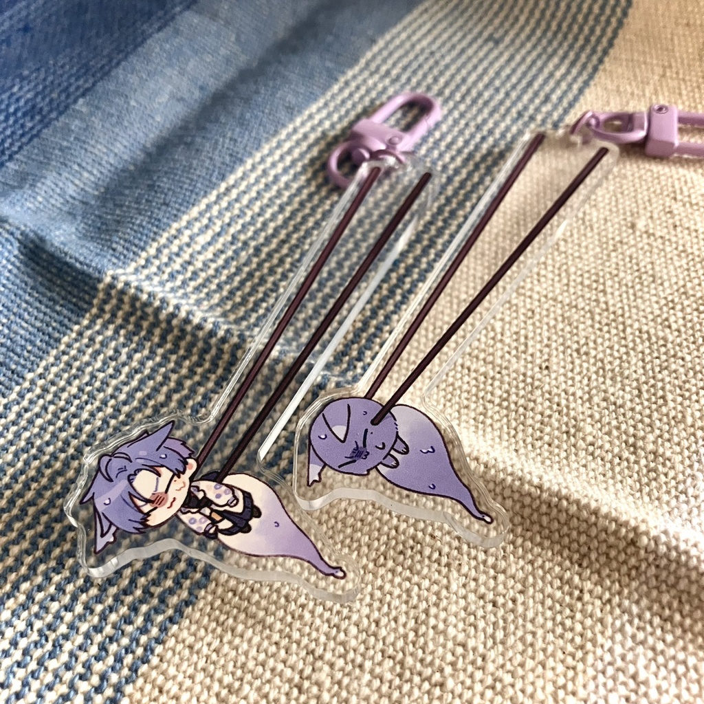 箸でつまむひたひたきつね