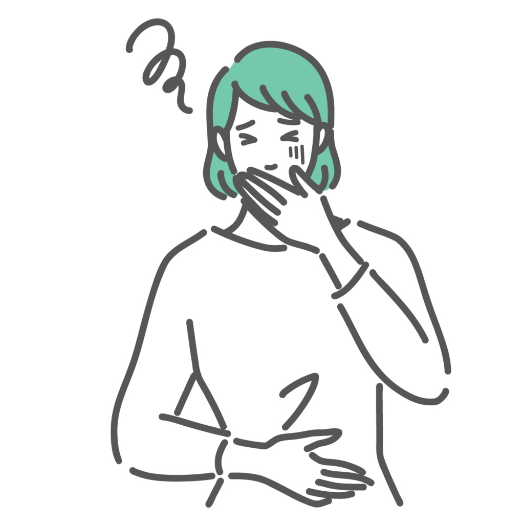 吐き気や胃の不調で口元を押さえる女性