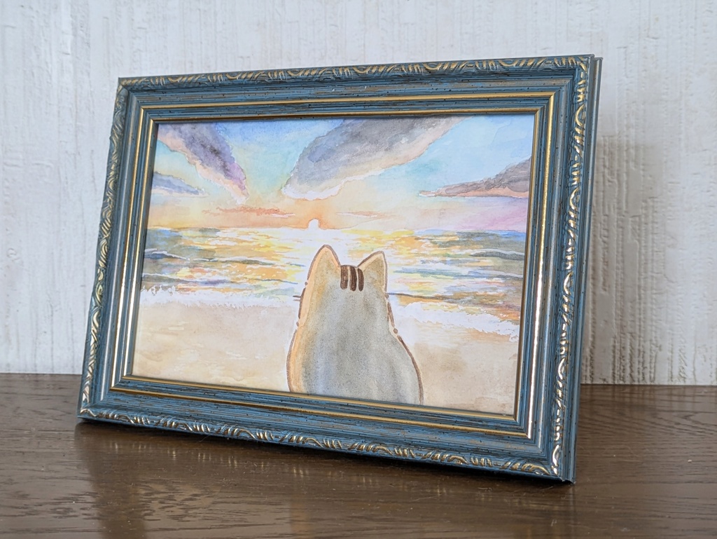 綺麗な夕日を海で見るぽてねこ