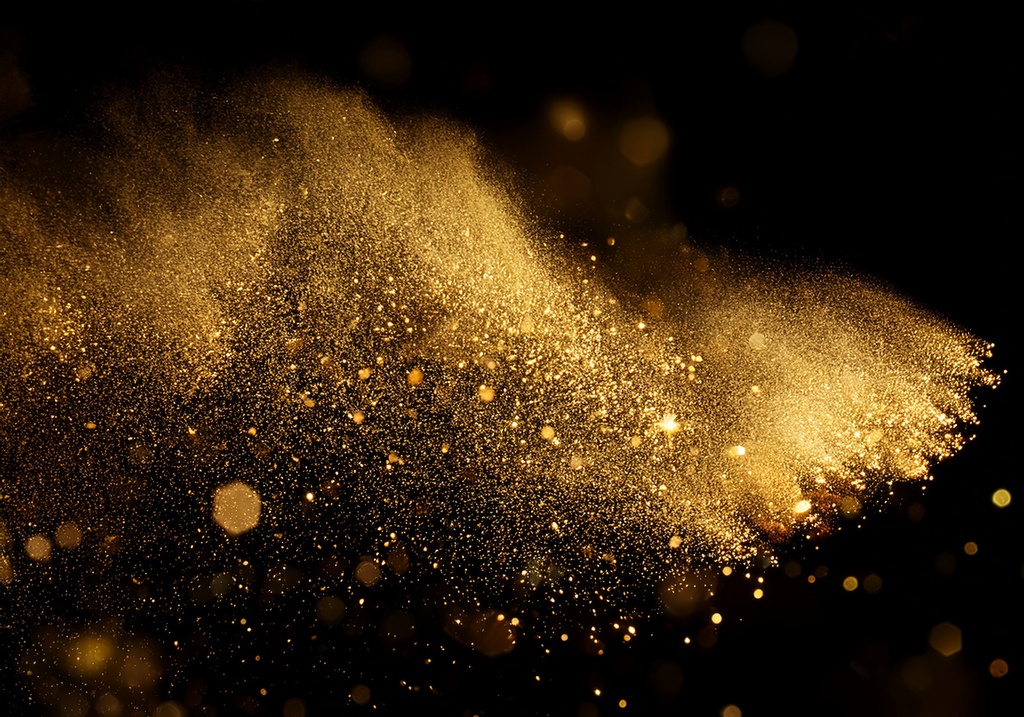 キラキラ輝く黄金パーティクル背景