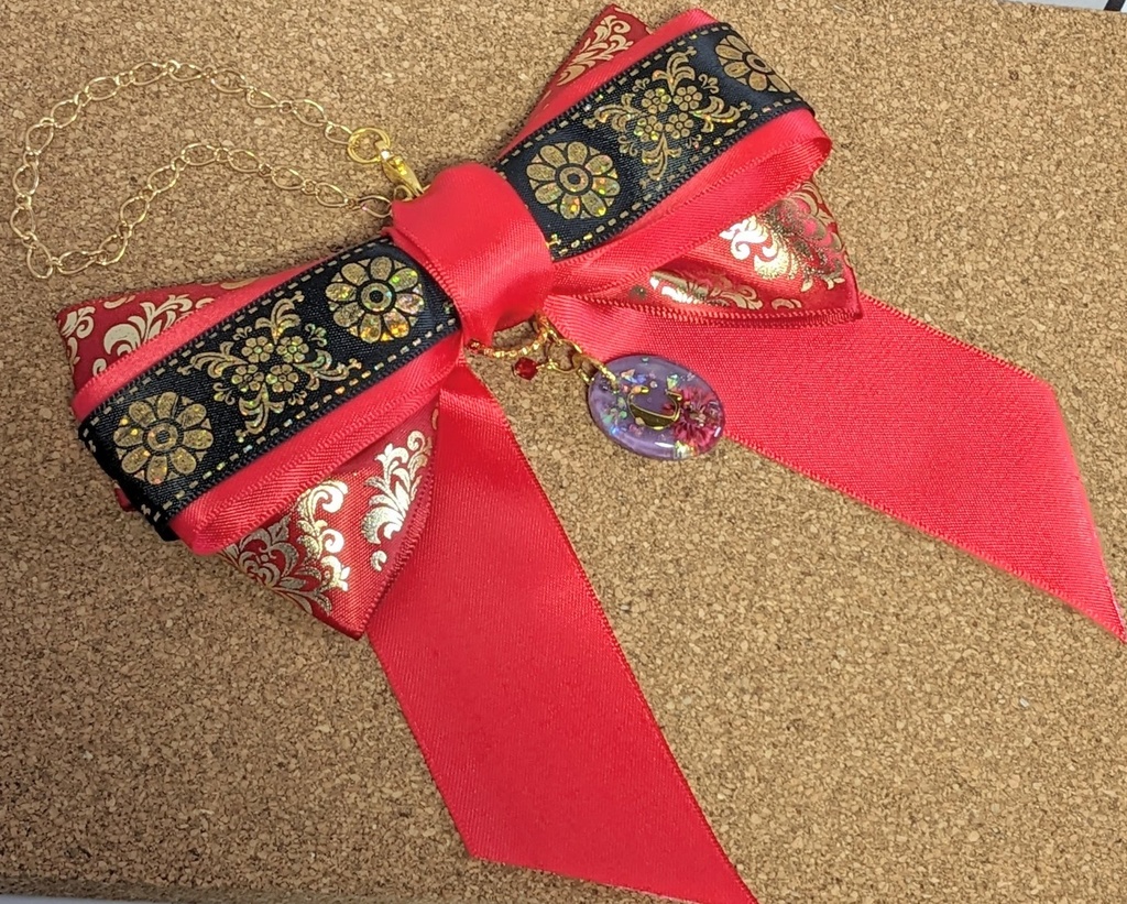 ブラスタ 柘榴イメージリボンバッグチャーム