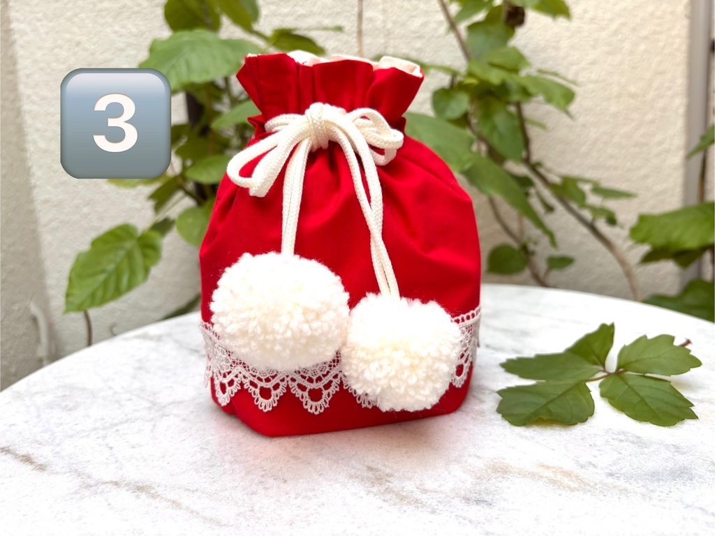 ポンポンつきレース巾着赤