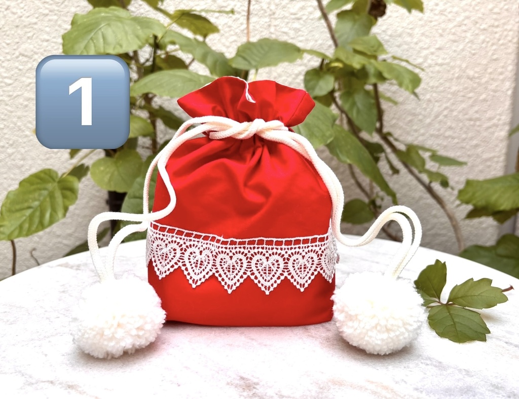 ポンポンつきレース巾着赤