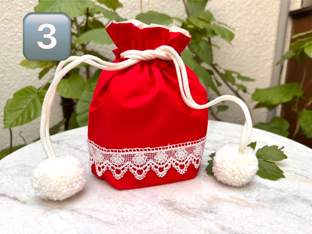 ポンポンつきレース巾着赤