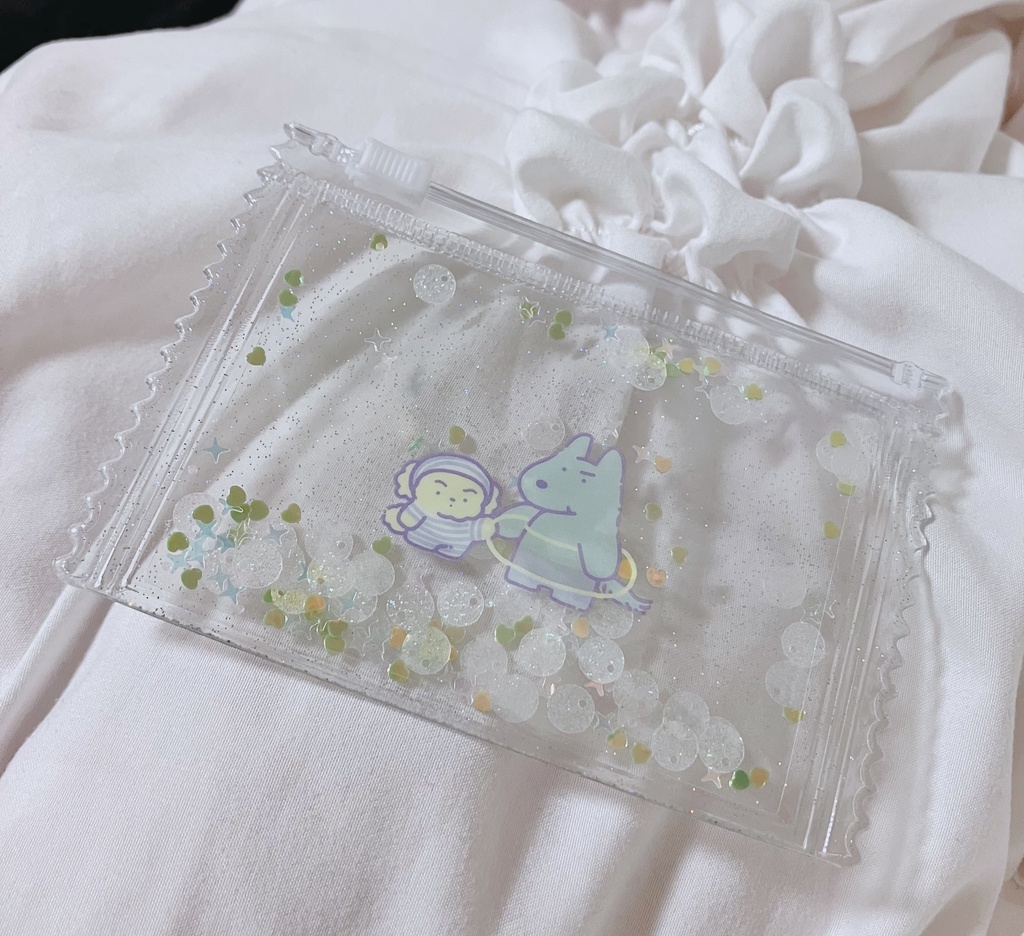 三リョ*クリアポーチ